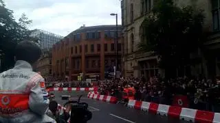 Jenson Button driving through Manchester