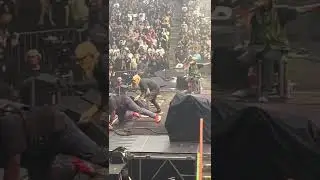 Fan rushes stage at Rage Against the Machine Show Toronto July 23 2022.   Tom Morello gets tackled