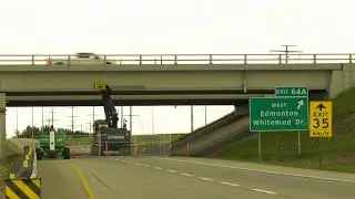 Excavator stuck in overpass bridge in Edmonton after collision