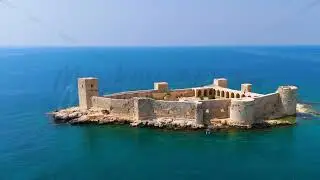 Dolly zoom. Kizkalesi, Mersin, Turkey. Maiden Castle island fortress completely surrounded by wat...