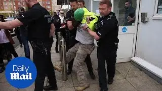 Sacked tesco security guard is taken away by police amid protests - Daily Mail