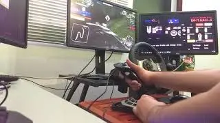 Playing Initial D zero with a Logitech flight stick instead of a wheel.