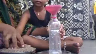 Sensory stimulation activity- Filling sand in the bottle.