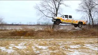 Jumping a Chevy truck off dirt bike jumps
