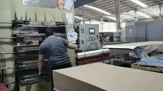 Mounted door skin produce Step1--Loading MDF boards for one-time processing of multiple door panels.