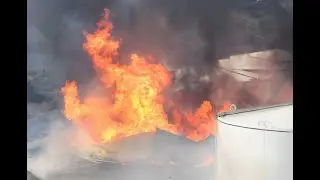 Storage tanks burning after a reported explosion at East Bay energy facility