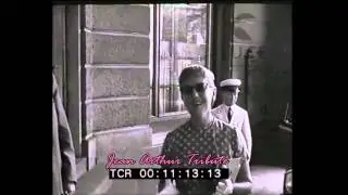 Jean Arthur, on vacation, arrives in Italy