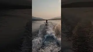 1st time riding a paddleboard behind a boat! Montana camping + pontoon boat + SUP = a blast!