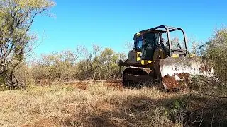 John Deere 750K Getting The Job Done. Clearing Brush For A New Property Line Fence.