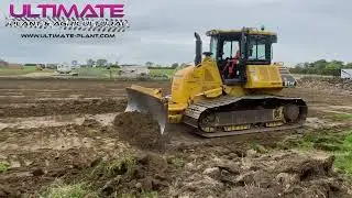Komatsu D61 Dozer stripping top soil, Rolling off the blade like carpet.