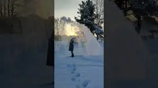 Boiling water freezing in mid air