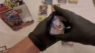 Obsidian flames booster box break! (part 2) pokemon charizard ex chase..