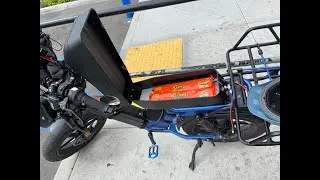 Juiced bikes scorpion dual battery in a hidden lockable compartment in upgraded NISA seat ebike