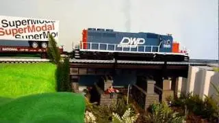 DW&P SD40 diesel-electric locomotive and Extended-Vision Caboose in O Scale