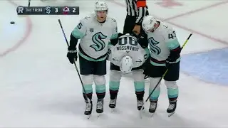 Marcus Johansson helped off the ice