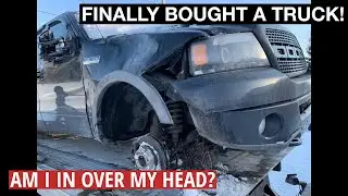 I bought a wrecked Ford F150 FX4 with roof damage and a missing wheel.