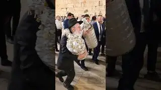 Jews celebrate the Simchat Torah holiday at the Western Wall in Jerusalem, Israel, in 2025