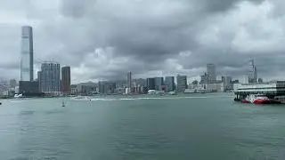 Harbor heartbeat - steel and tide keep time beneath a storm-swept sky ⛴️🏙️