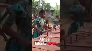 African kids playing traditional instruments