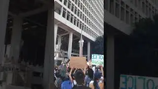Defund the police, no justice no peace. Across the street from city hall