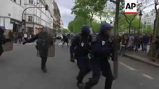Riot police use tear gas as May Day protests turn violent in Paris