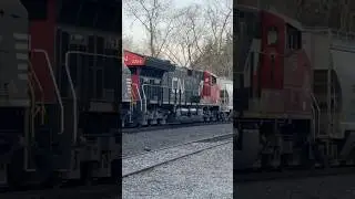 CN locomotive on a sand train