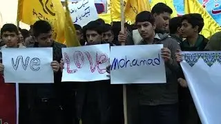 Iranian students protest outside the French embassy in Tehran