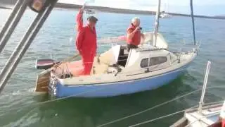 Three men in two boats