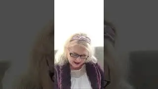 Sonja reading Revelation out loud in a King James Version Bible