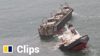 Massive cargo ship cracks in two, leaking oil after running aground in Japan