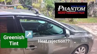 Greenish clear  ceramic tint with heat rejection..Phantom brand.( Vios )