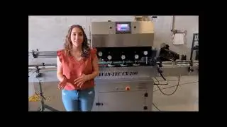 Automatic inline bottle capping machine.
