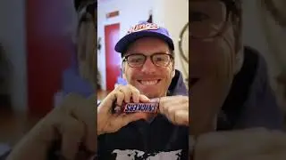 Opening a Snickers bar like they do in commercials