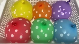 Cutting Colorful Water Balloons in Slow Motion: The Mesmerizing Splash Art!