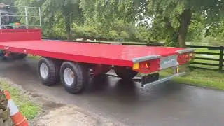 New Marshall 25ft Bale Trailer heading out on flotation tyres - Supplied by AgriSource Machinery