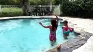 Carys and Arden singing in the pool to Frozen Let It Go