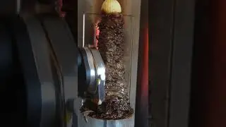 Shaving Lamb Shawarma. Look how juicy it is!