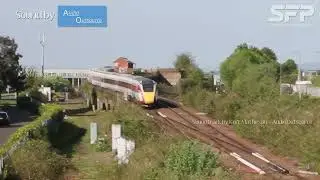 LNER Azuma train departing Dundee heading towards Tay Rail Bridge viewed from Seabraes Bridge 100524