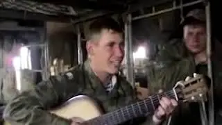 Russian soldier sings to the guitar: 