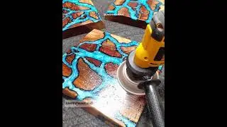 Pouring teal epoxy resin into burned fractal rivers