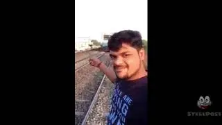 guy takes selfie in front of train...