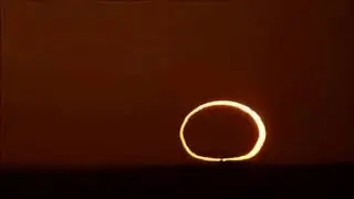 The Moon blocking the Sun at sunrise