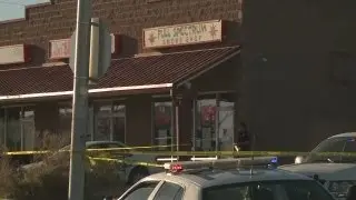 Dead robber's widow sues shop clerk