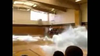 A whale jumping out of a local gym room floor