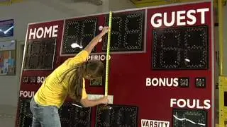 Vinyl Graphic Installation on a Scoreboard