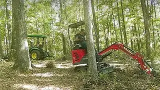 Land clean up with 3025e and mini ex