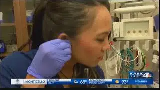 Nurse Clarissa Hardman uses hearing aid and special stethoscope to allow her to hear her patients