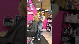 Finishing the hair service with a cut and curl. 