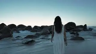 4K Free Stock Footage &ndash; Woman by the Sea on Rocky Coast | No Copyright Cinematic Video