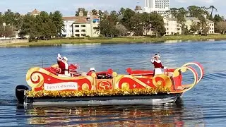 Santa & Mrs. Claus Greet Guests Distanced from a Pontoon Boat at Disney Springs for Holidays 2020